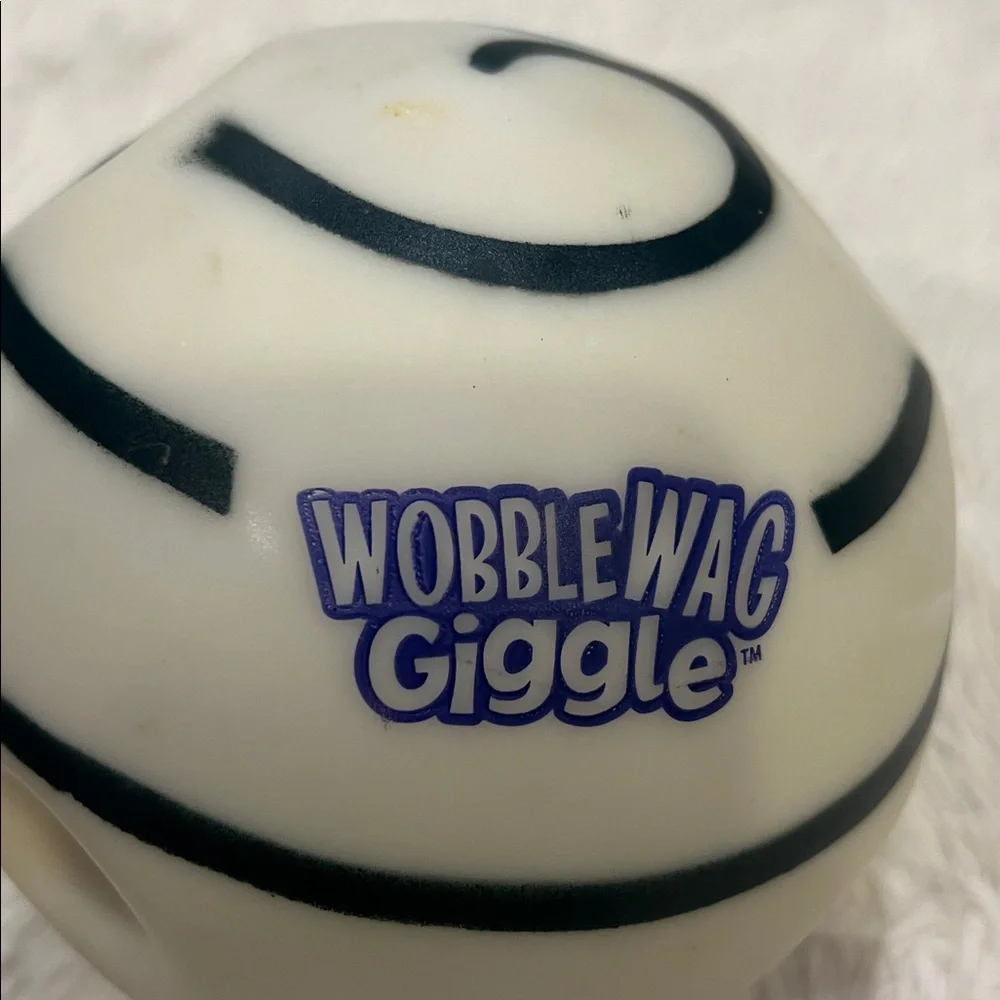 Slightly used Wobble Wag Giggle dog toy made of durable hard plastic.